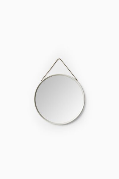 White lacquered round mirror with leather strap at Studio Schalling