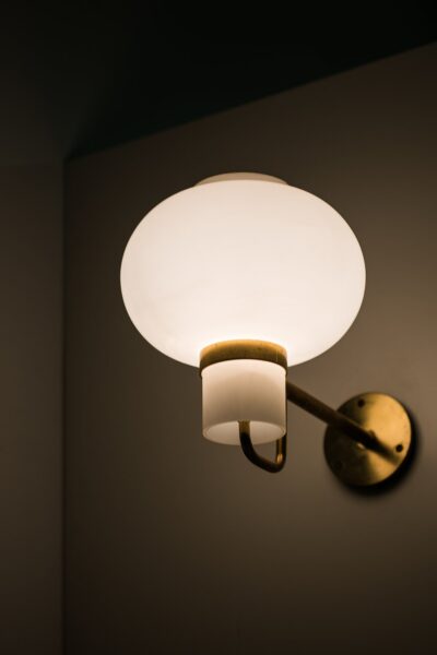Wall lamps in brass and opaline glass at Studio Schalling