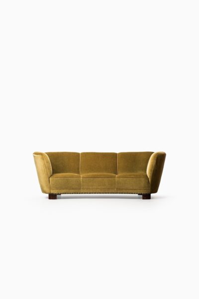 Large curved sofa in green / yellow velvet at Studio Schalling