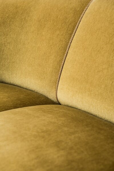 Large curved sofa in green / yellow velvet at Studio Schalling