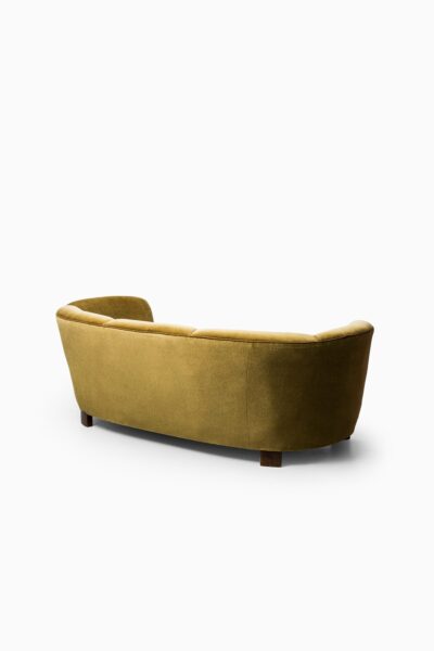 Large curved sofa in green / yellow velvet at Studio Schalling