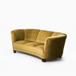 Large curved sofa in green / yellow velvet at Studio Schalling
