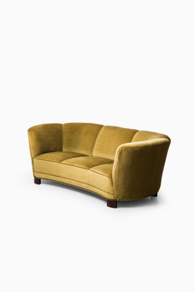 Large curved sofa in green / yellow velvet at Studio Schalling