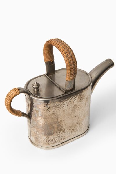 Teapot in metal and woven cane by Carl Deffner at Studio Schalling