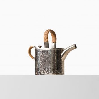 Teapot in metal and woven cane by Carl Deffner at Studio Schalling