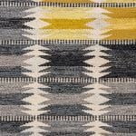 Ingrid Dessau carpet in grey and yellow at Studio Schalling