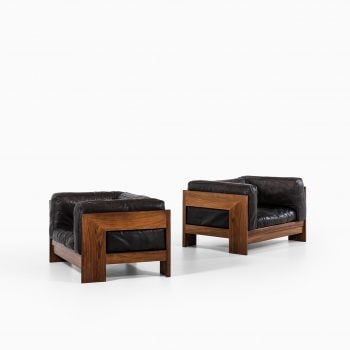 Pair of easy chairs in rosewood and leather at Studio Schalling