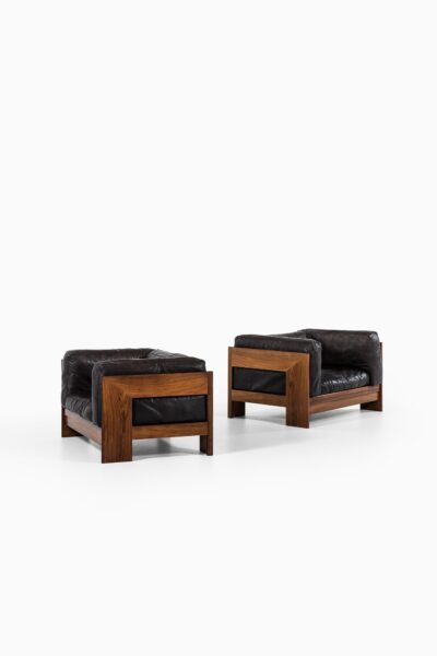 Pair of easy chairs in rosewood and leather at Studio Schalling