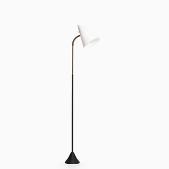 Floor lamp in brass with white lamp shade at Studio Schalling