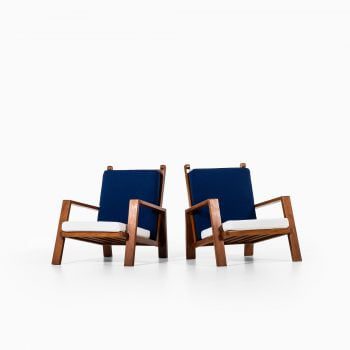 Pair of easy chairs in teak and fabric at Studio Schalling