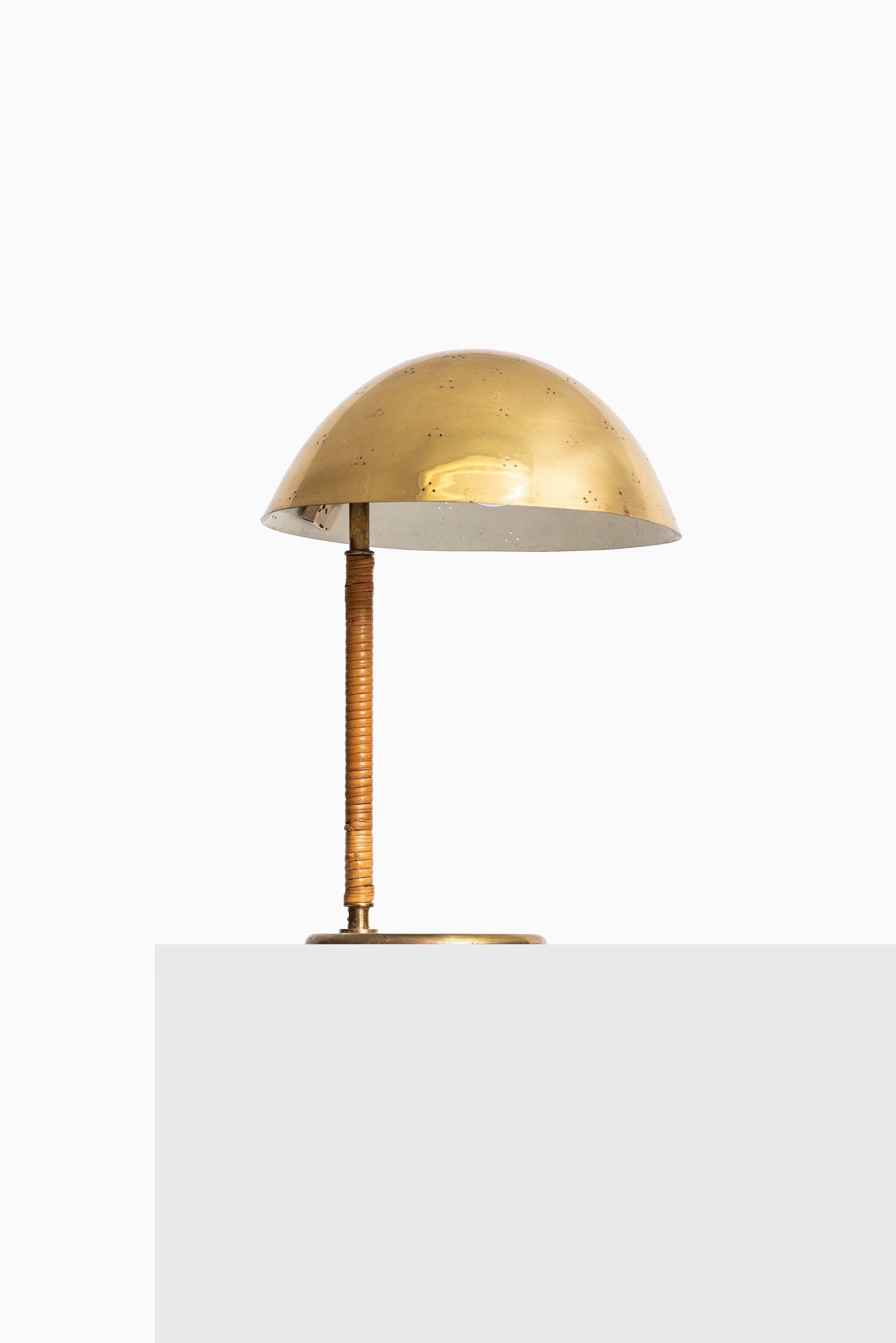 Paavo Tynell table lamp in brass and cane at Studio Schalling