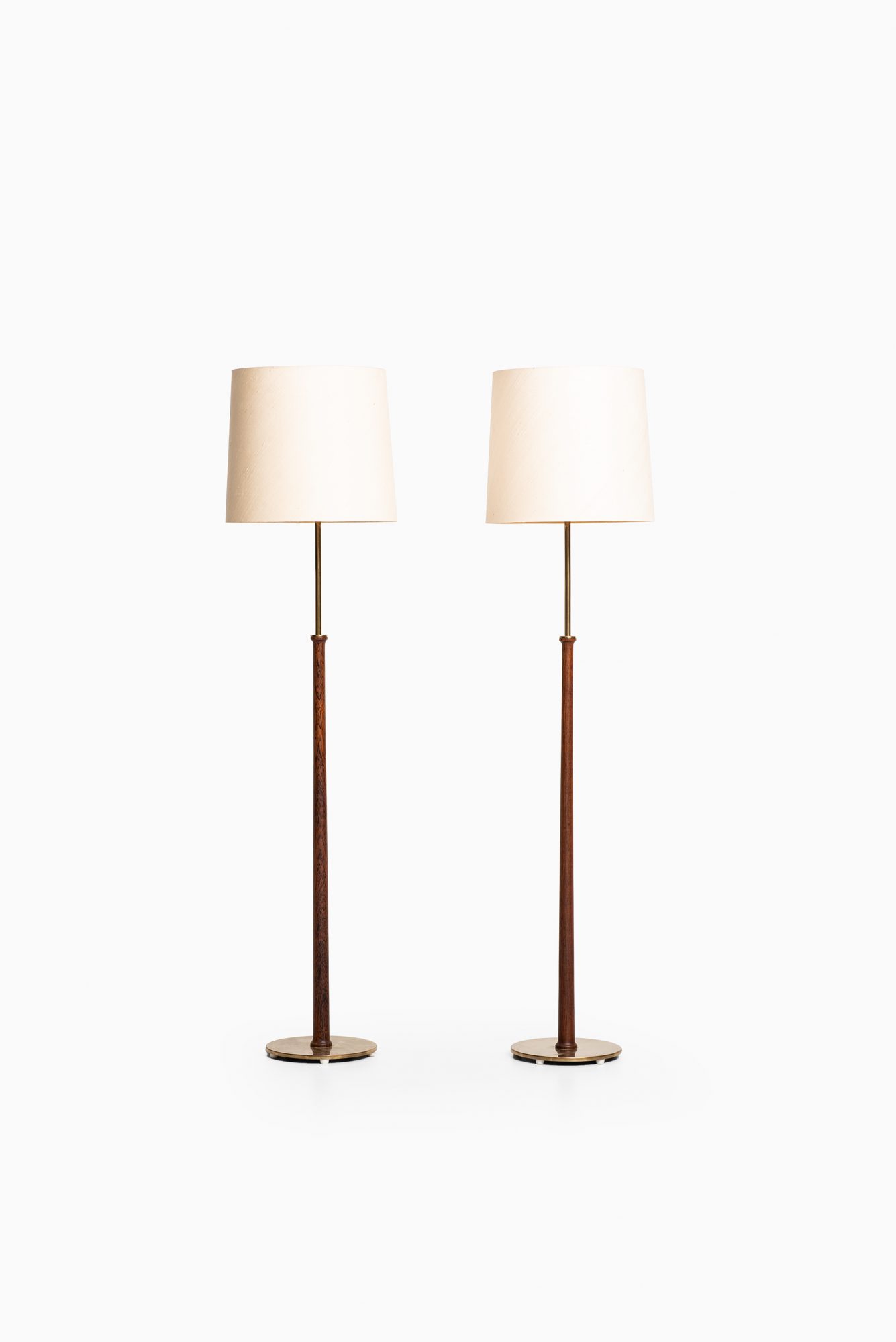 Pair of floor lamps in rosewood by Bergbom at Studio Schalling