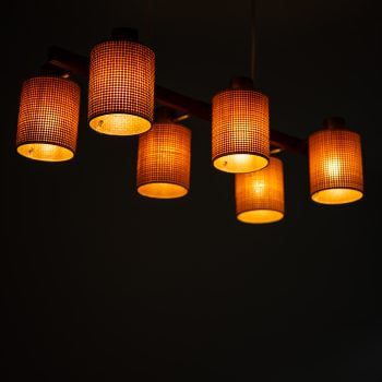 Hans Bergström ceiling lamp in brass and teak at Studio Schalling