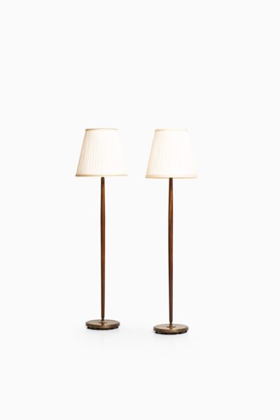 Böhlmarks floor lamps in brass and mahogany at Studio Schalling