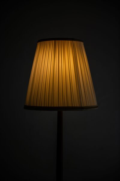 Böhlmarks floor lamps in brass and mahogany at Studio Schalling