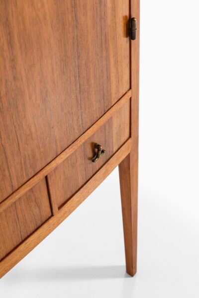 Rosewood cabinet with brass details at Studio Schalling