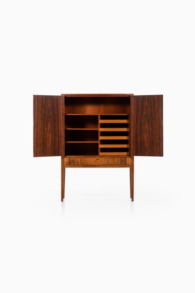 Rosewood cabinet with brass details at Studio Schalling