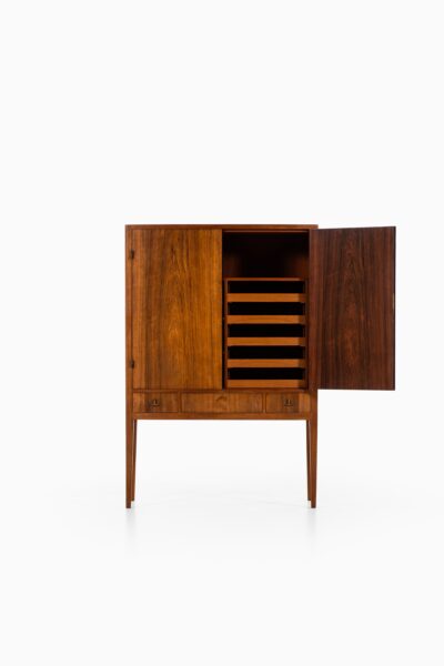 Rosewood cabinet with brass details at Studio Schalling