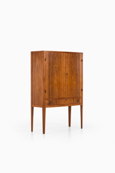 Rosewood cabinet with brass details at Studio Schalling