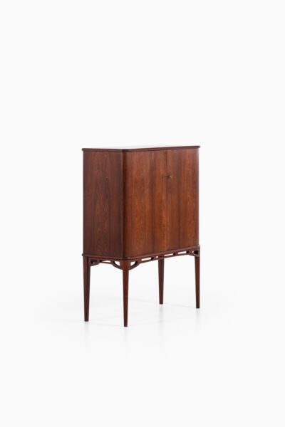 Rosewood cabinet with brass details at Studio Schalling