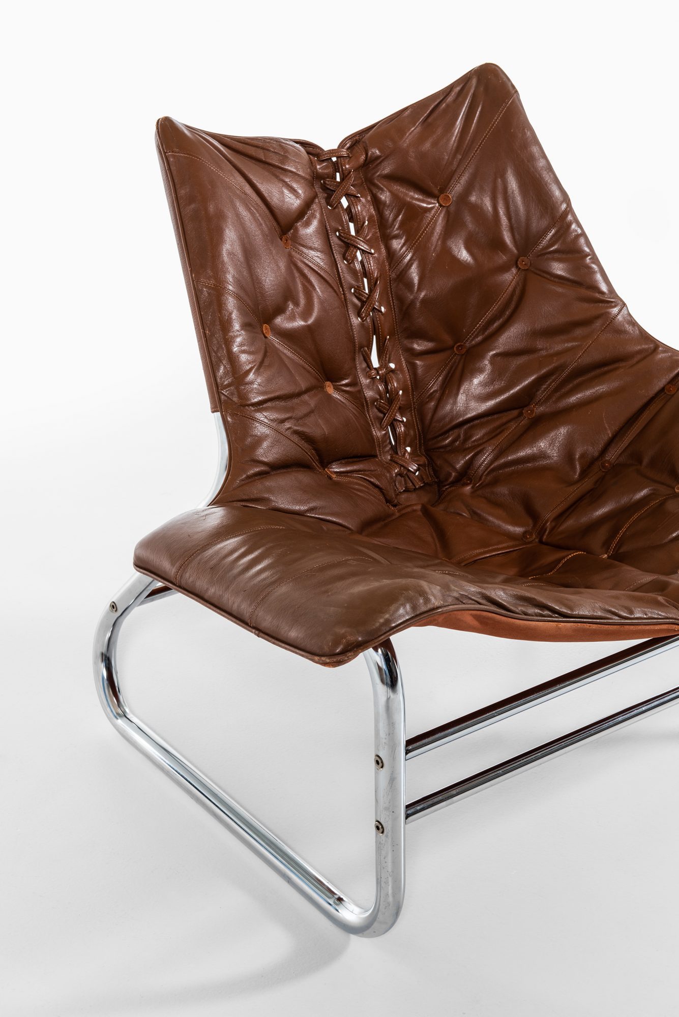 Easy chair in chromed steel and leather at Studio Schalling