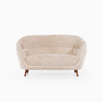 Arne Norell sofa in dark stained beech and sheepskin at Studio Schalling
