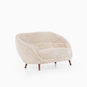 Arne Norell sofa in dark stained beech and sheepskin at Studio Schalling