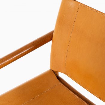 Easy chairs in oak and cognac brown leather at Studio Schalling