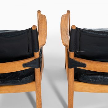 Gunnar Myrstrand easy chairs in oak and black leather at Studio Schalling