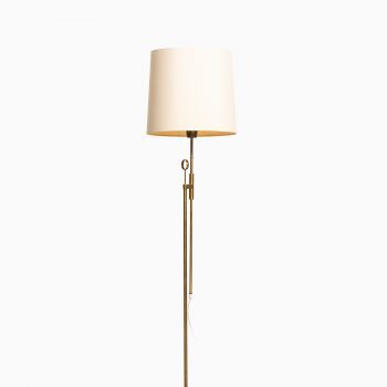 Height adjustable floor lamp in brass at Studio Schalling