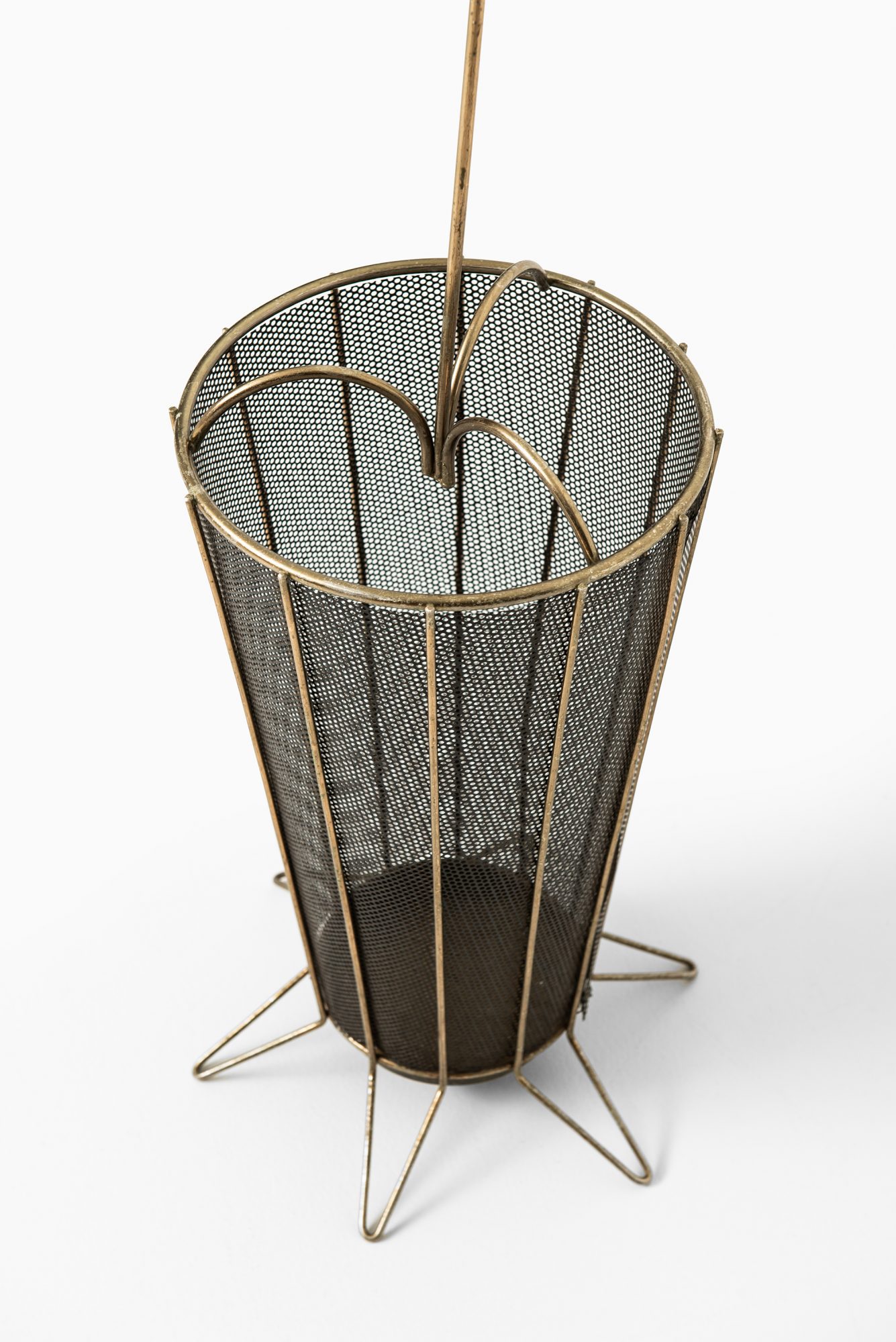 Umbrella stand in brass and black lacquered metal at Studio Schalling