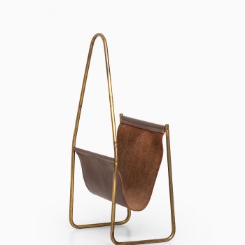 Carl Auböck magazine stand in brass and leather at Studio Schalling