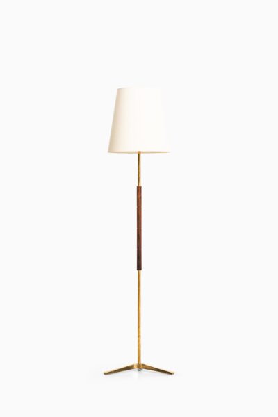 Pair of floor lamps in brass and rosewood at Studio Schalling