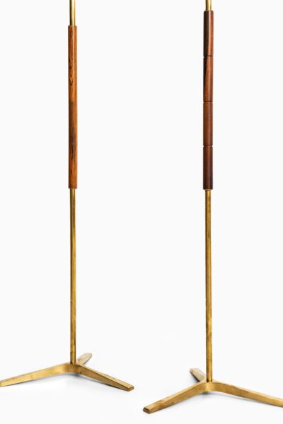 Pair of floor lamps in brass and rosewood at Studio Schalling