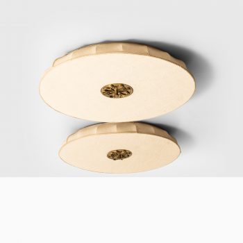 Pair of flush mount ceiling lamps in brass at Studio Schalling