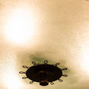 Flush mount ceiling lamp in brass and glass at Studio Schalling