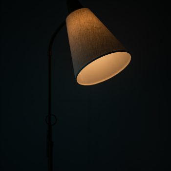 Height adjustable floor lamp in brass at Studio Schalling