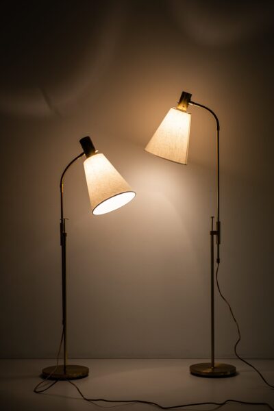 Pair of floor lamps in brass by Falkenbergs belysning at Studio Schalling