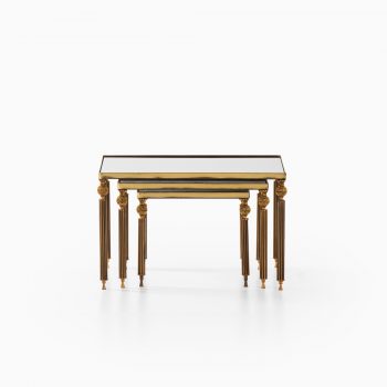 Nesting tables in brass and mirrored glass at Studio Schalling
