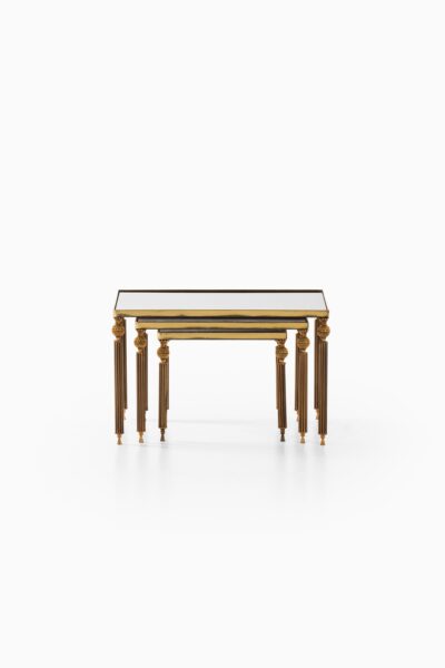Nesting tables in brass and mirrored glass at Studio Schalling