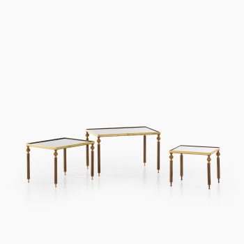 Nesting tables in brass and mirrored glass at Studio Schalling