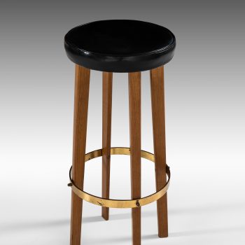 Bar stools in teak and brass at Studio Schalling