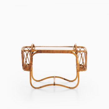 Side table with removable tray in rattan at Studio Schalling