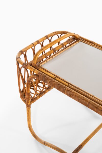 Side table with removable tray in rattan at Studio Schalling