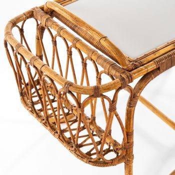 Side table with removable tray in rattan at Studio Schalling