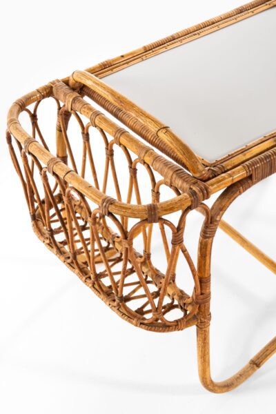 Side table with removable tray in rattan at Studio Schalling