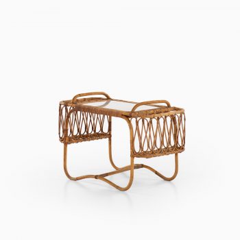Side table with removable tray in rattan at Studio Schalling