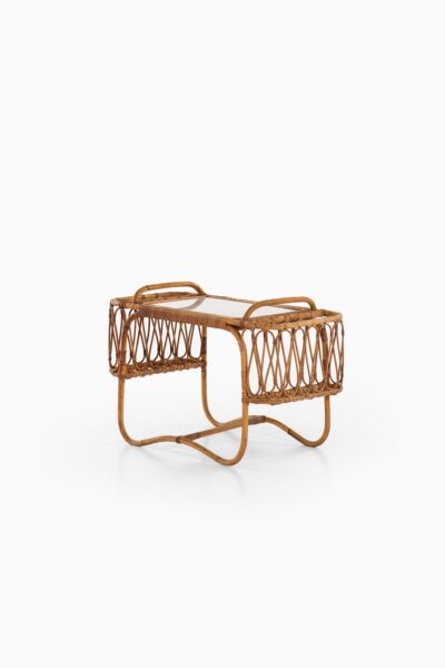 Side table with removable tray in rattan at Studio Schalling