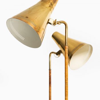 Paavo Tynell floor lamps model K-10 in brass and cane at Studio Schalling