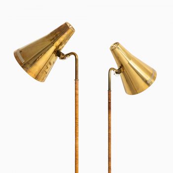 Paavo Tynell floor lamps model K-10 in brass and cane at Studio Schalling